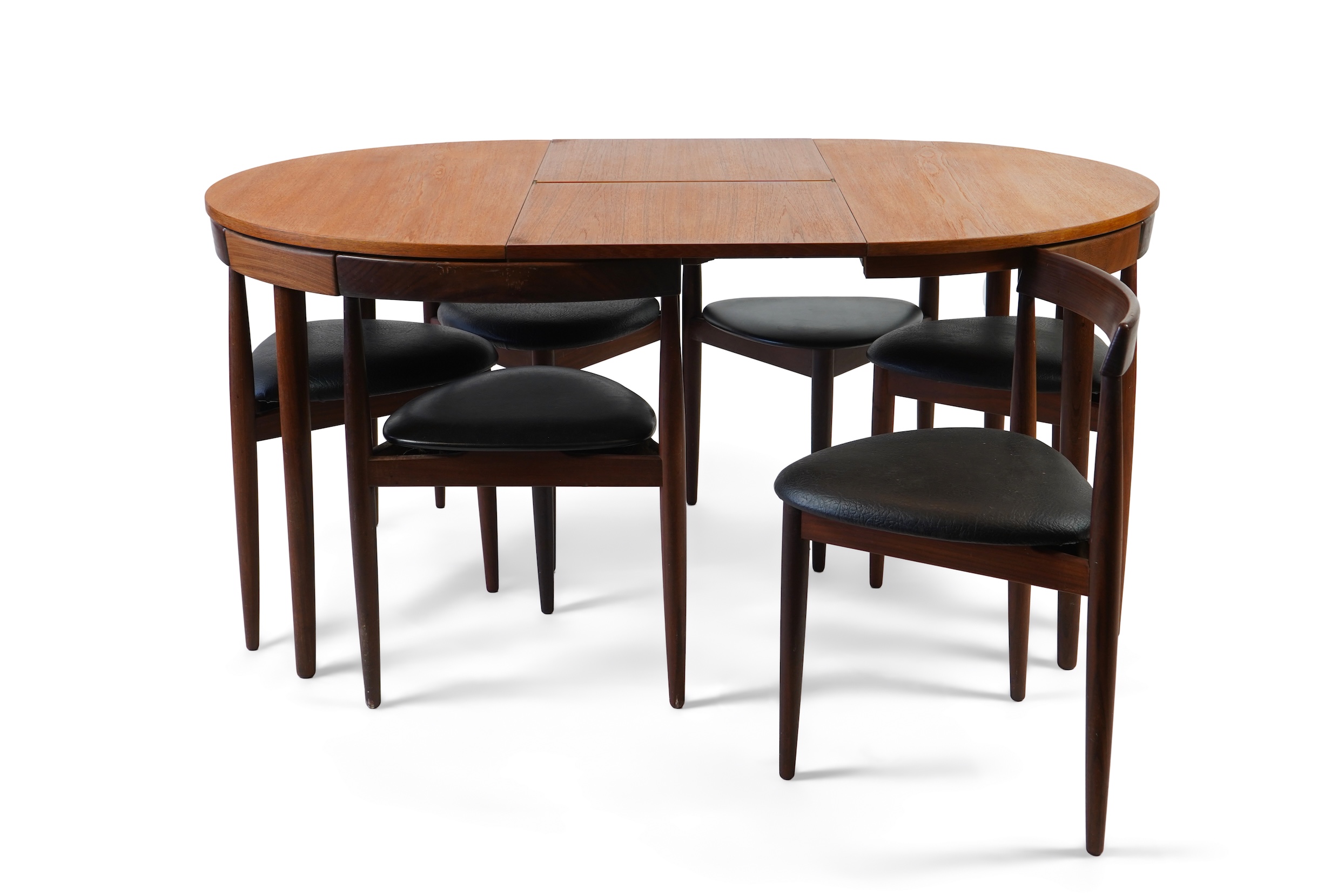 Hans Olsen (Danish, 1919–1992) for Frem Røjle: A Danish teak 'Roundette' extending dining table and six chairs